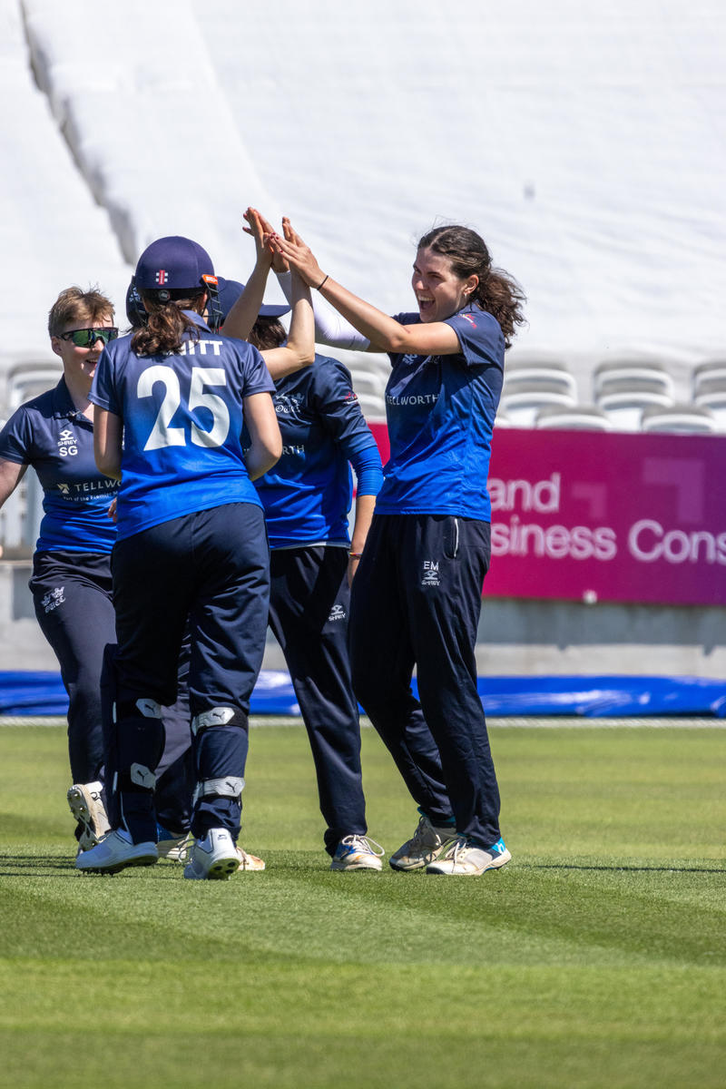 Evie Mayhew celebrating a wicket