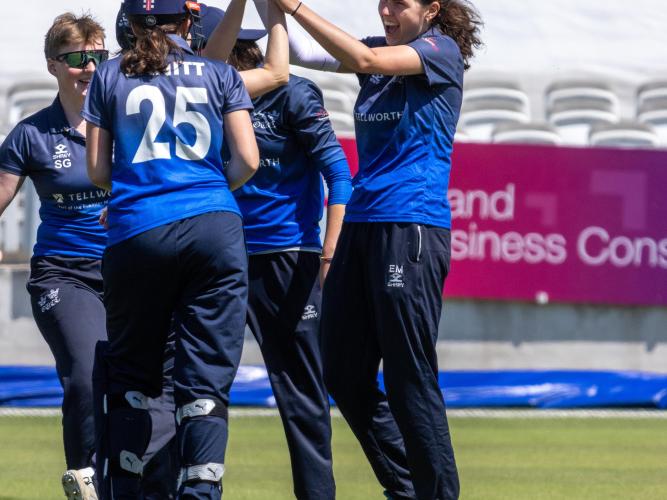 Evie Mayhew celebrating a wicket